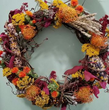 Wreaths by Starbright bring together corn and wheat to evoke of the harvest.