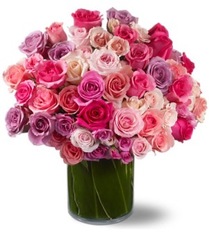 Starbright’s fresh roses are paired with verdant Ti leaves for an incredible display.
