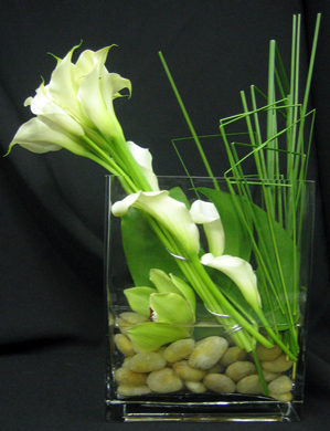 Calla lilies and blades of grass are combined to brilliant effect.